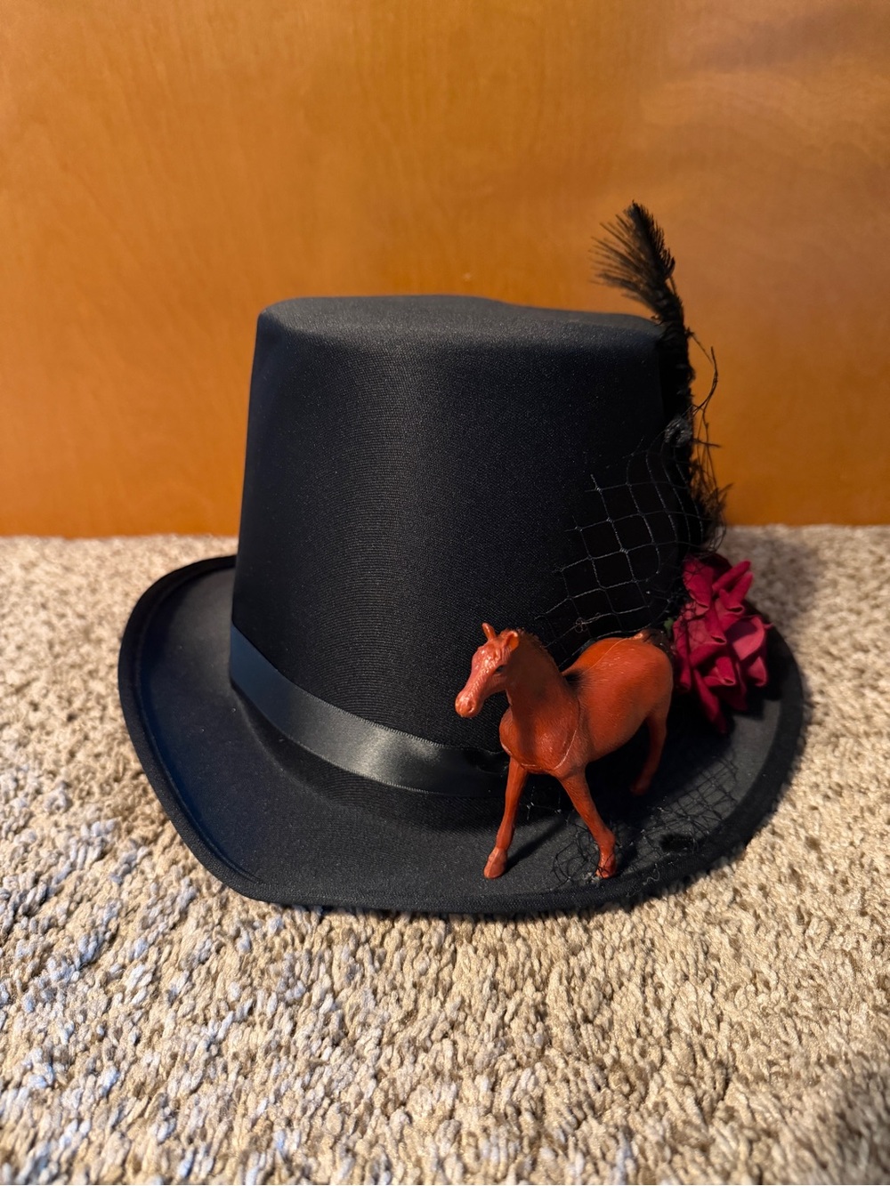Black Top Hat with Horse, Roses, and Feather Accents